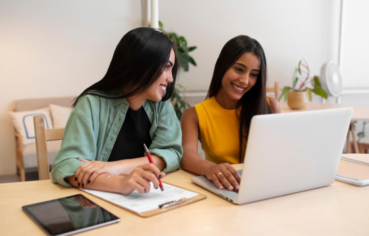 Small business owner reviewing financial reports and planning documents in modern office setting